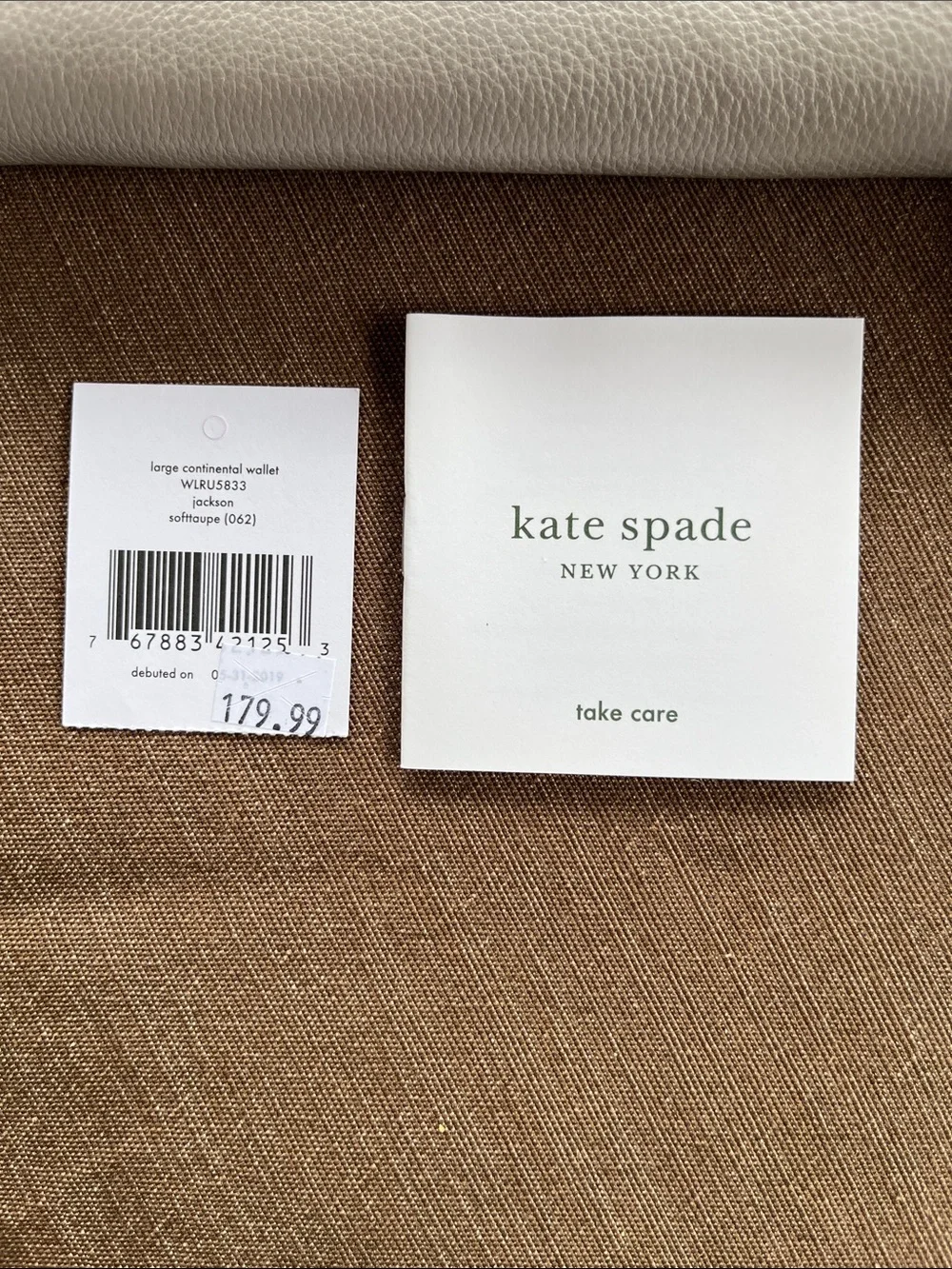 kate spade White Pebbled Leather Zip Wallet